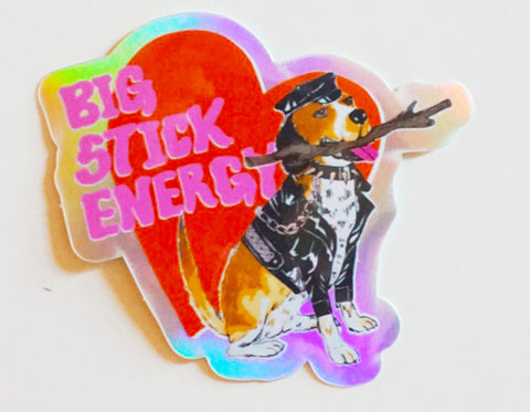 red heart with dog in leather cap and jacket holding a stick in it's mouth. text reads big stick energy