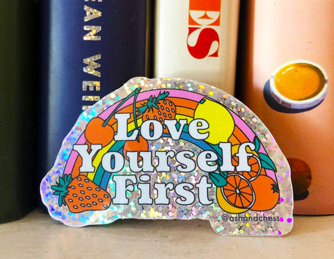 holographic sticker with rainbow and fruits text reads love yourself first