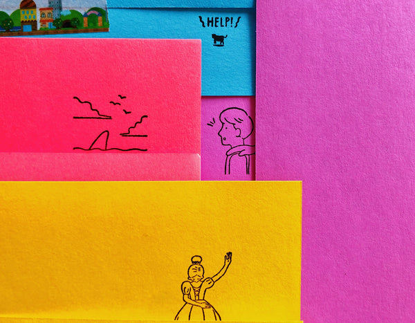 These stamps are meant to be fully revealed by unfolding a piece of paper. A fun surprise in a note! 4 different designs- a cow alien abduction, a shark in the water, a hand on a shoulder, and a dancer.