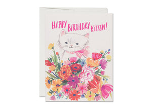 blooming flower bouquet with a sweet white kitten that has a pink bow tied around it's neck. text reads happy birthday kitten!