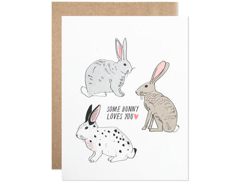 three rabbits surround text that reads some bunny loves you with a heart