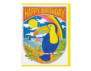 toucan in foreground with rainbow and sailboats text reads happy birthday