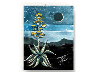 night sky with moon, bright agave plant in forefront text reads miss you