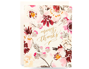 cream background with watercolor florals surrounding text that reads many thanks in gold foil