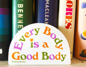 half circle sticker text reads every body is a good body in purple orange, and green.