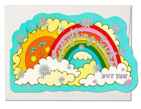 die cut card blue background sun and rainbow clouds text reads in glitter foil everything sucks but you