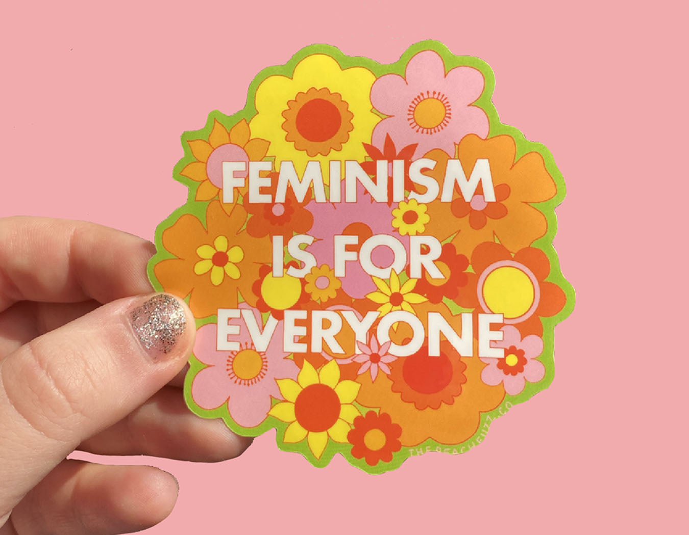 illustrated floral background sticker with text that reads feminism is for everyone in pink green yellow orange pink and white.