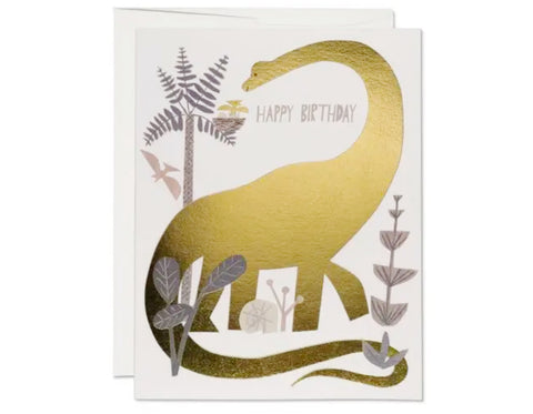 folded card with a gold foil dinosaur and plants