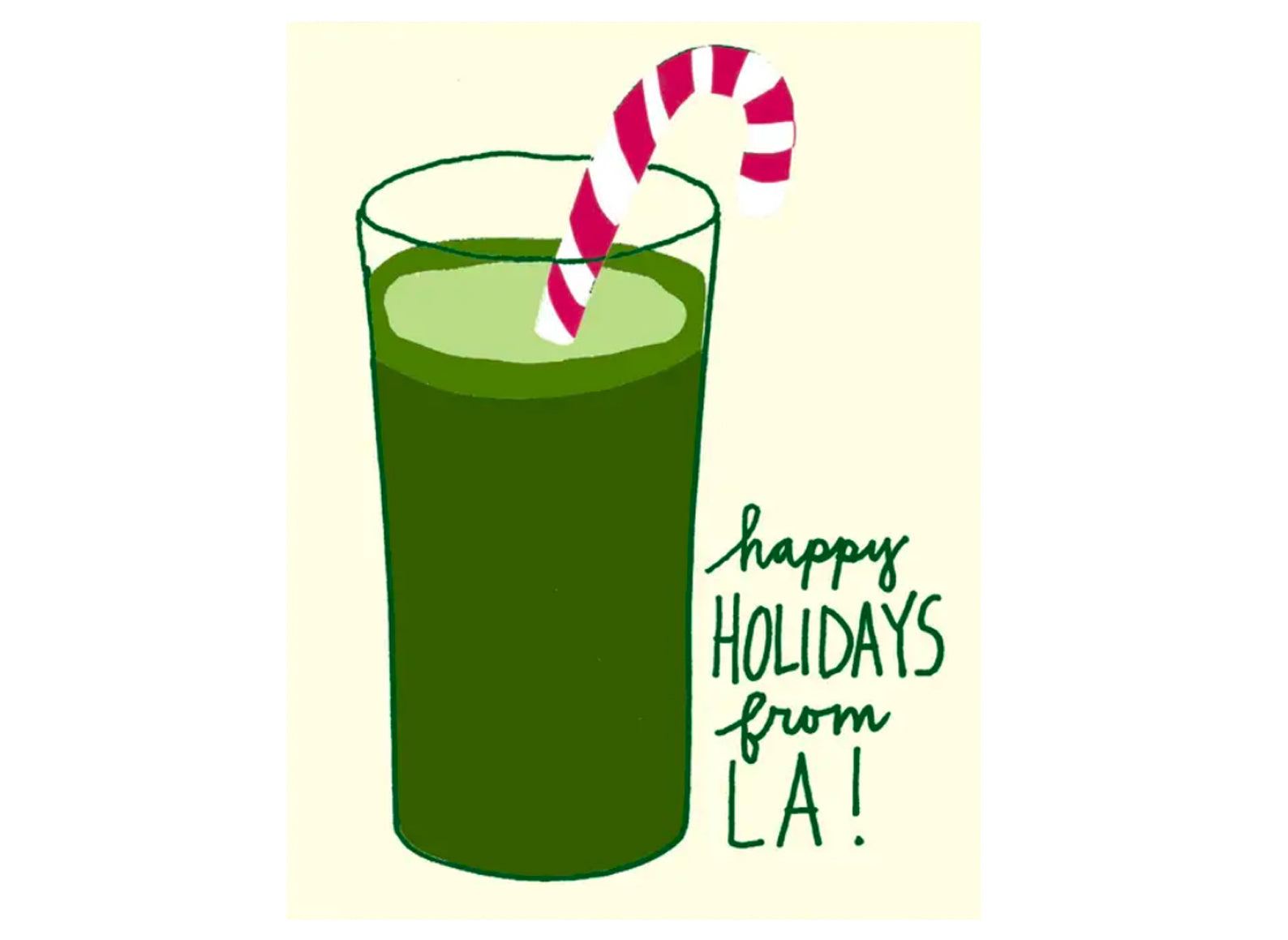 green juice with candy cane in it reads happy holidays from la!
