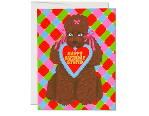 sweet chocolate brown poodle holding heart in mouth text reads happy birthday stupid