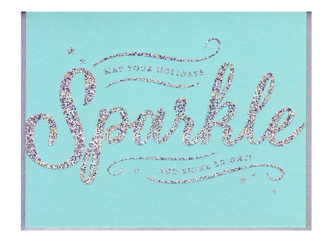 text reads may your holidays sparkle and shine bright! on light blue background