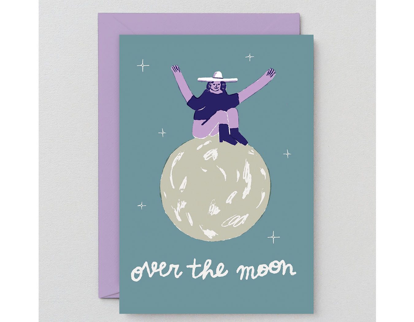 teal background illustrated woman in hat sitting on moon text reads over the moon