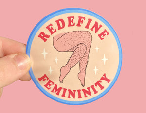 circle sticker text reads redefine femininity with crossed hairy legs